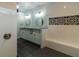 Elegant bathroom with double sinks, frameless shower, and modern fixtures at 38530 Wooded Meadow Drive, Umatilla, FL 32784