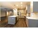 Modern kitchen with a large island, stainless steel appliances, and white cabinets at 38530 Wooded Meadow Drive, Umatilla, FL 32784
