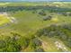 Aerial view of property showcasing the lot and surrounding landscape at 38530 Wooded Meadow Drive, Umatilla, FL 32784