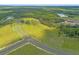 Aerial view showcasing a lot with road access and natural surroundings at 38530 Wooded Meadow Drive, Umatilla, FL 32784