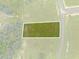 Aerial view of a vacant lot bordered by roads and trees at 38530 Wooded Meadow Drive, Umatilla, FL 32784
