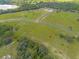 Aerial view of a large lot near a lake at 38530 Wooded Meadow Drive, Umatilla, FL 32784