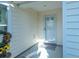 Front entry with a glass door and a small welcome mat at 1750 Kingfisher Ct, The Villages, FL 32162