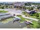 Aerial view of waterfront homes and lush landscape at 27637 Lisa Dr, Tavares, FL 32778