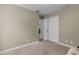 Simple bedroom with double doors to closet at 27637 Lisa Dr, Tavares, FL 32778