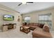 Relaxing living room with sectional sofa and large TV at 27637 Lisa Dr, Tavares, FL 32778