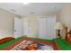 Bedroom with double doors to closet and view to another room at 27637 Lisa Dr, Tavares, FL 32778
