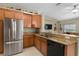 Kitchen has stainless steel appliances and granite countertops at 27637 Lisa Dr, Tavares, FL 32778