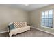 Cozy bedroom with a comfortable sofa and window at 27637 Lisa Dr, Tavares, FL 32778