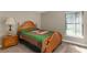 Bright bedroom with wood bed frame at 27637 Lisa Dr, Tavares, FL 32778