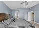 Main bedroom with a king-size bed and en-suite bathroom access at 27637 Lisa Dr, Tavares, FL 32778
