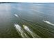 Aerial view of boats speeding across lake at 27637 Lisa Dr, Tavares, FL 32778
