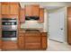 Kitchen features stainless steel appliances and wood cabinets at 27637 Lisa Dr, Tavares, FL 32778