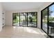 Sunroom with sliding doors opening to patio at 27637 Lisa Dr, Tavares, FL 32778