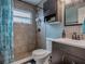 Updated bathroom with a shower/tub combo and modern vanity at 4988 County Road 155, Wildwood, FL 34785