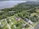 Home near Lake Deaton Park and wooded area at 4988 County Road 155, Wildwood, FL 34785