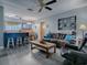 Open living space with kitchen, seating, and a view to the kitchen at 4988 County Road 155, Wildwood, FL 34785