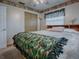 Spacious bedroom with a ceiling fan and ample closet space at 4988 County Road 155, Wildwood, FL 34785