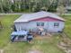 House with a spacious backyard and a detached storage shed at 4988 County Road 155, Wildwood, FL 34785