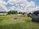 Large backyard with fire pit and plenty of space for outdoor activities at 4988 County Road 155, Wildwood, FL 34785