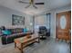 Living room with a comfy couch and a coffee table at 4988 County Road 155, Wildwood, FL 34785