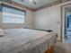 Bright bedroom featuring a comfortable bed and plenty of natural light at 4988 County Road 155, Wildwood, FL 34785