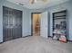 Versatile bedroom with built-in shelving and access to a bathroom at 4988 County Road 155, Wildwood, FL 34785