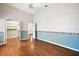 Bedroom with walk-in closet and wood floors at 4907 Tara View Rd, Leesburg, FL 34748