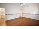 Bedroom with hardwood floors, a ceiling fan, and walk-in closet at 4907 Tara View Rd, Leesburg, FL 34748