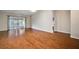Bright living room featuring hardwood floors and access to a patio at 4907 Tara View Rd, Leesburg, FL 34748