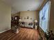 Bright living room with hardwood floors and comfortable couch at 36641 Tropical Wind Ln, Grand Island, FL 32735