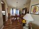 Charming dining room with hardwood floors and wood furniture at 36641 Tropical Wind Ln, Grand Island, FL 32735