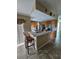 Kitchen island with seating and plenty of counter space at 36641 Tropical Wind Ln, Grand Island, FL 32735