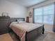 Bedroom with a double bed and dresser at 10548 Bronze Leaf Ct, Leesburg, FL 34788