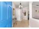 Bright entryway with a blue door and tile flooring at 30549 Pga Dr, Sorrento, FL 32776