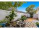 Private backyard oasis with lush landscaping and patio at 30549 Pga Dr, Sorrento, FL 32776