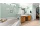 Spa-like bathroom with double sinks and garden tub at 30549 Pga Dr, Sorrento, FL 32776