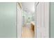 View down a hallway to a large bathroom with a tub at 30549 Pga Dr, Sorrento, FL 32776