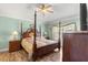 Spacious bedroom with a large bed and ceiling fan at 30549 Pga Dr, Sorrento, FL 32776