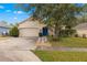 Quaint one-story home with stone accents at 30549 Pga Dr, Sorrento, FL 32776