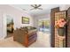 Living room with access to the pool and a comfortable couch at 30549 Pga Dr, Sorrento, FL 32776