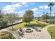 Enjoy the fire pit with seating area near the lake at 8732 Providence Ct, Mount Dora, FL 32757