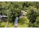 Aerial view showing home, driveway and landscaping at 26225 Troon Ave, Sorrento, FL 32776