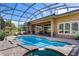 Resort-style pool with screened enclosure and spacious patio at 5235 Island Terrace Ct, Lady Lake, FL 32159