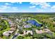 Community overview with a picturesque lake and variety of homes at 1238 Glendora Rd, Kissimmee, FL 34759