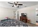 Spacious bedroom with a large bed, TV, and plenty of space at 5120 Tanzanite Dr, Mount Dora, FL 32757