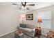 Cozy sitting room with a sofa, side table, and window at 5120 Tanzanite Dr, Mount Dora, FL 32757