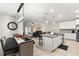 Open concept kitchen with island, stainless steel appliances, and white cabinetry at 5120 Tanzanite Dr, Mount Dora, FL 32757