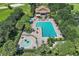 Community pool with a separate splash pad and clubhouse at 5120 Tanzanite Dr, Mount Dora, FL 32757