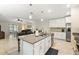 Well-equipped kitchen with white cabinetry, stainless steel appliances, and an island at 5120 Tanzanite Dr, Mount Dora, FL 32757
